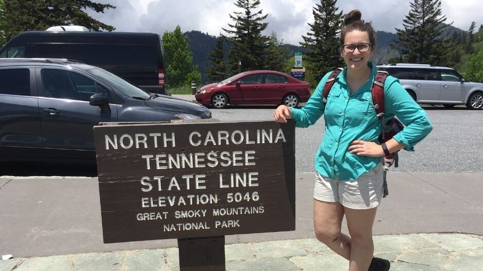 Sarah Sassoross in the outdoors near a sign - Alumni Spotlight: Sarah Sassorossi Class of '17 - Department of Forest Biomaterials NC State