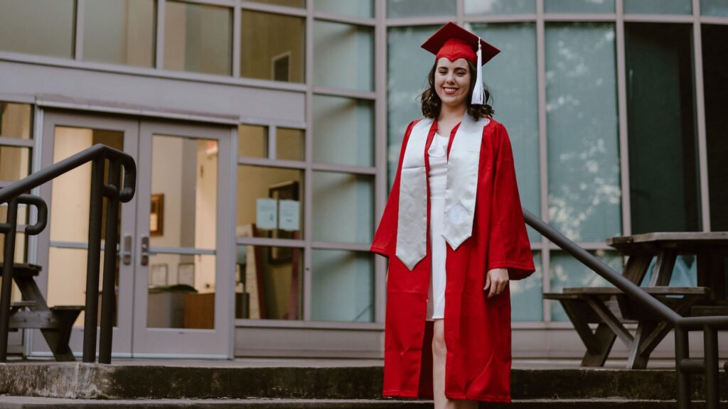 Sarah Putney in grad regalia outside Biltmore Hall - Forest Biomaterials NC State University