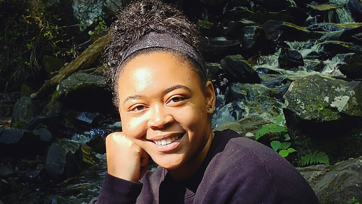 Lauren Pharr in woods - Black Excellence: Wildlife Biologist Lauren Pharr - NC State University College of Natural Resources Department of Forestry and Environmental Resources