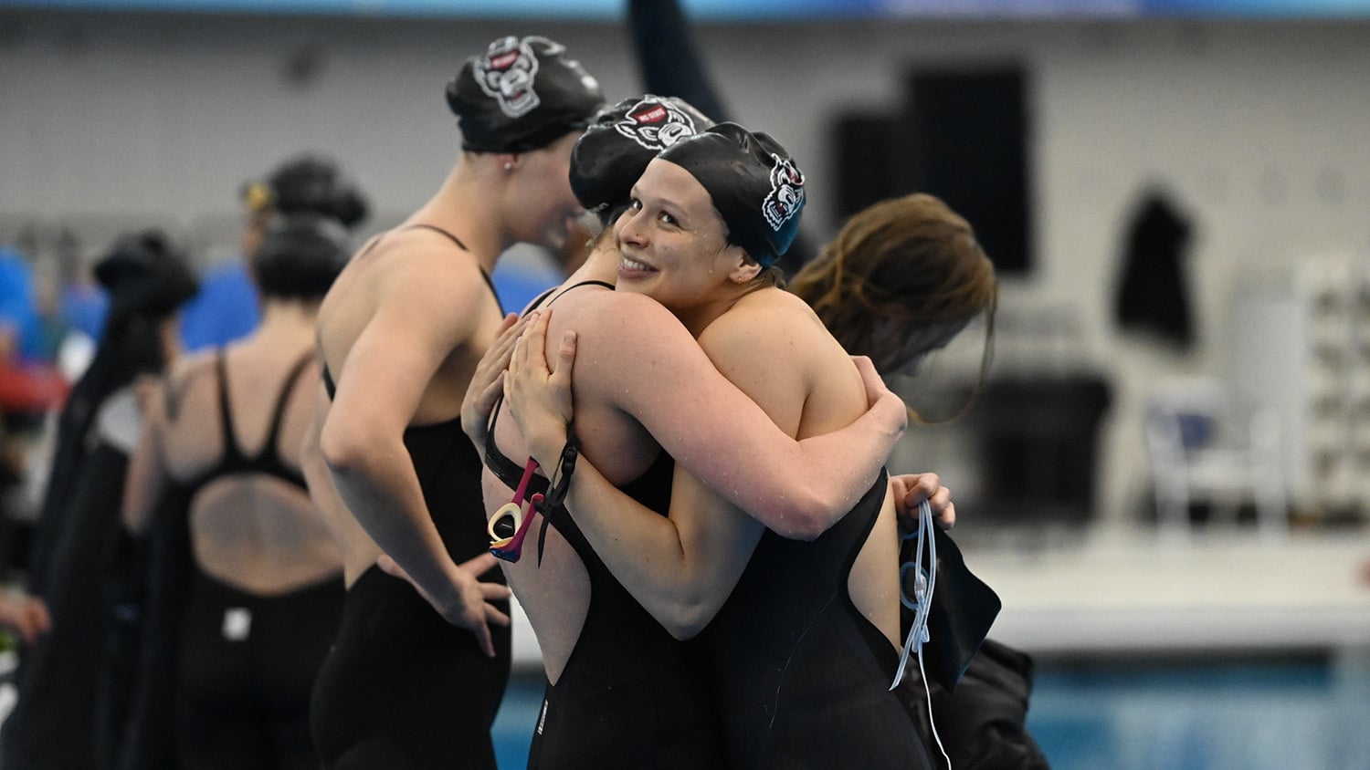 Sirena Rowe hugs a teammate at the NCAA championships in Greensboro - Strong Finish - Forestry and Environmental Resources Department at NC State