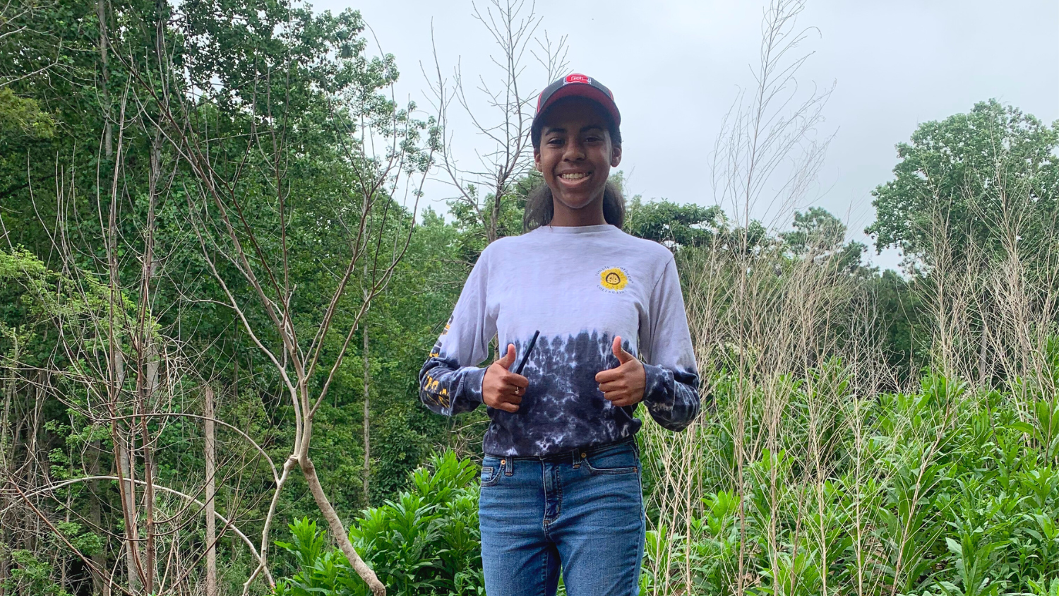 Student gives thumbs up in the field - CNR High School Summer Research Program - Forestry and Environmental Resources at NC State University