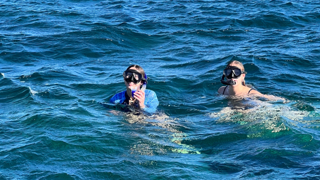 Tatiana and her friend snorkeling in blue water - Tatiana Frontera’s Semester in Australia - Forestry and Environmental Resources at NC State University