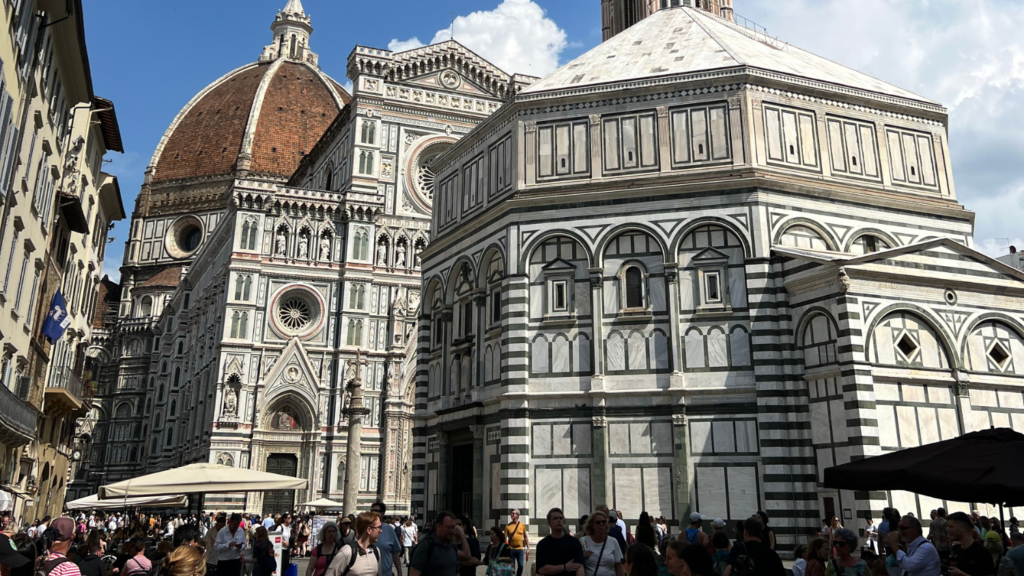 Large white cathedral with a large crowd of visitors standing around on the sidewalk- Trey Mumma’s Travels in Italy - Forestry and Environmental Resources at NC State University
