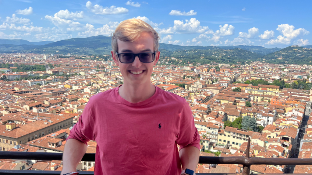 Picture of Trey with the city of Florence, Italy in the background - Trey Mumma’s Travels in Italy - Forestry and Environmental Resources at NC State University