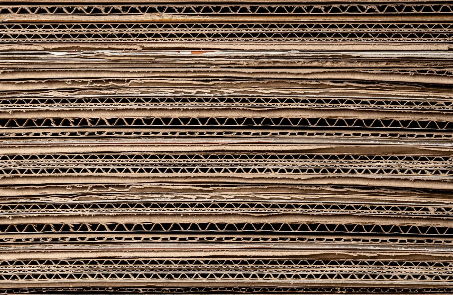 flattened cardboard boxes stacked on top of each other - Improving Wood Products Could Be a Key to Reducing Greenhouse Gas Emissions - Forestry and Environmental Resources at NC State University