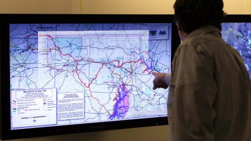 A graduate certificate student using a touchscreen at the North Carolina State University Center for Geospatial Analytics