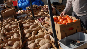 potatoes and tomatoes at an outdoor market