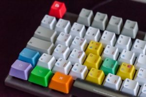 a computer keyboard with keys of different colors