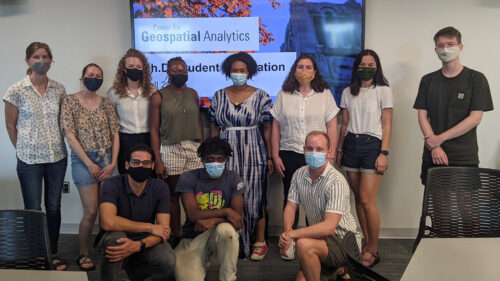 Students pose masked at Ph.D. orientation in Fall 2021 - 