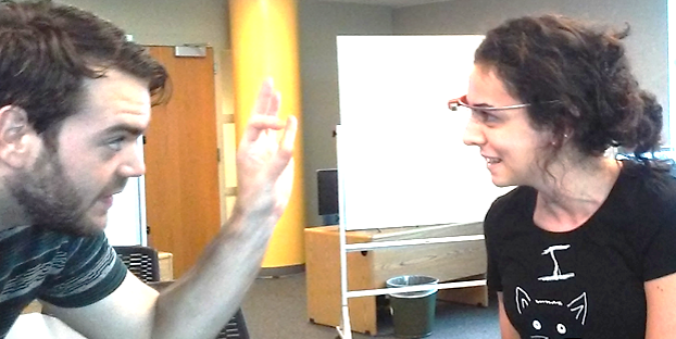 A photo of two Masters of Geospatial Information Science and Technology students using Google Glass at the North Carolina State University Center for Geospatial Analytics