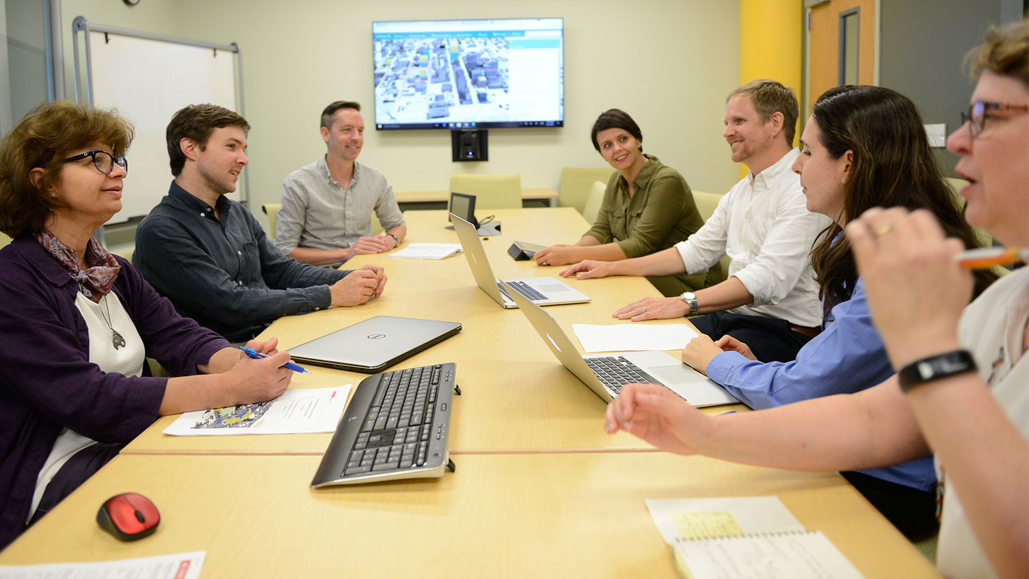 A photo of a meeting at the North Carolina State University Center for Geospatial Analytics