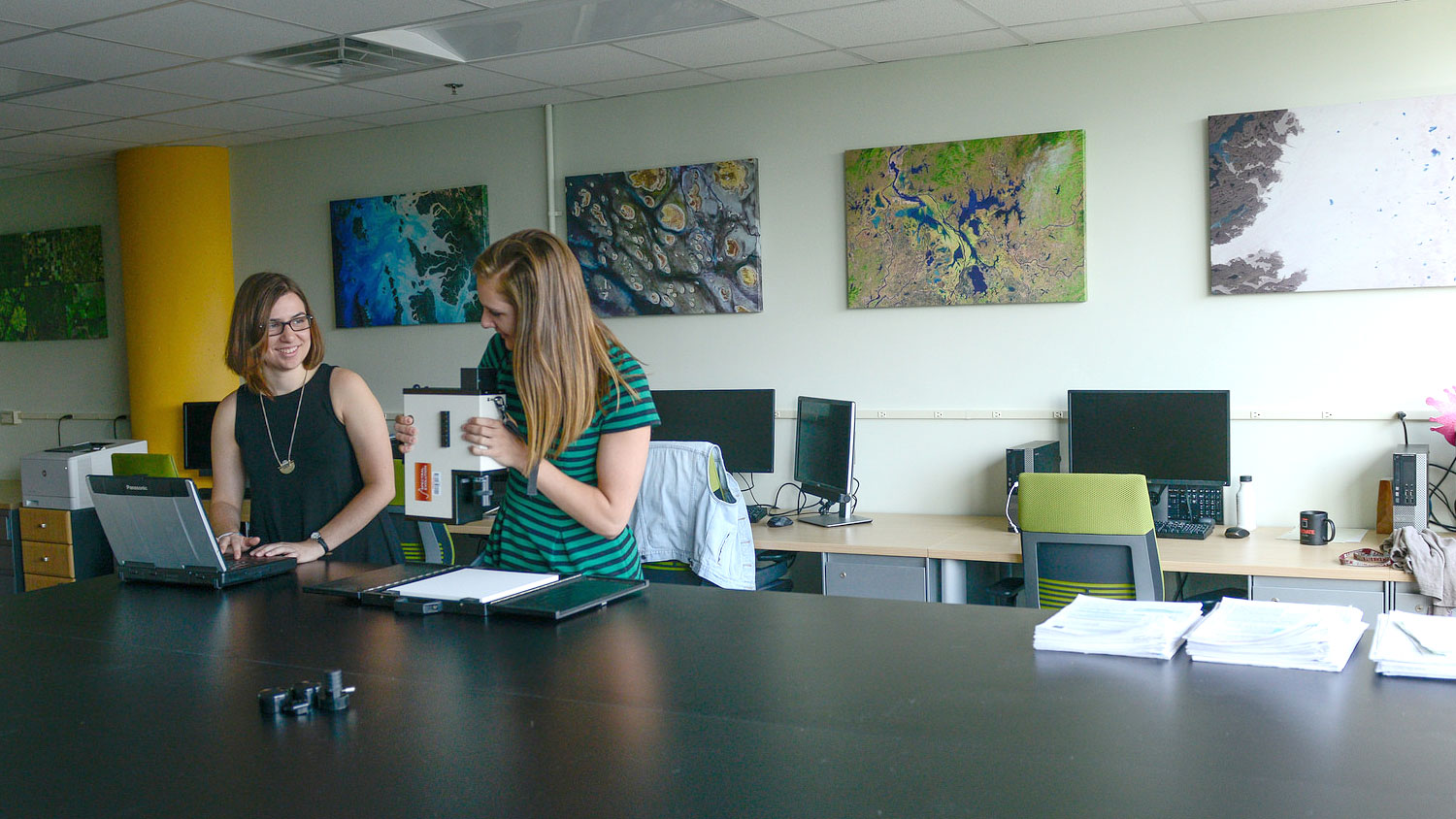 A photo of two women in the lab prep area at the North Carolina State University Center for Geospatial Analytics
