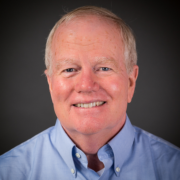 A headshot of Hugh Devine