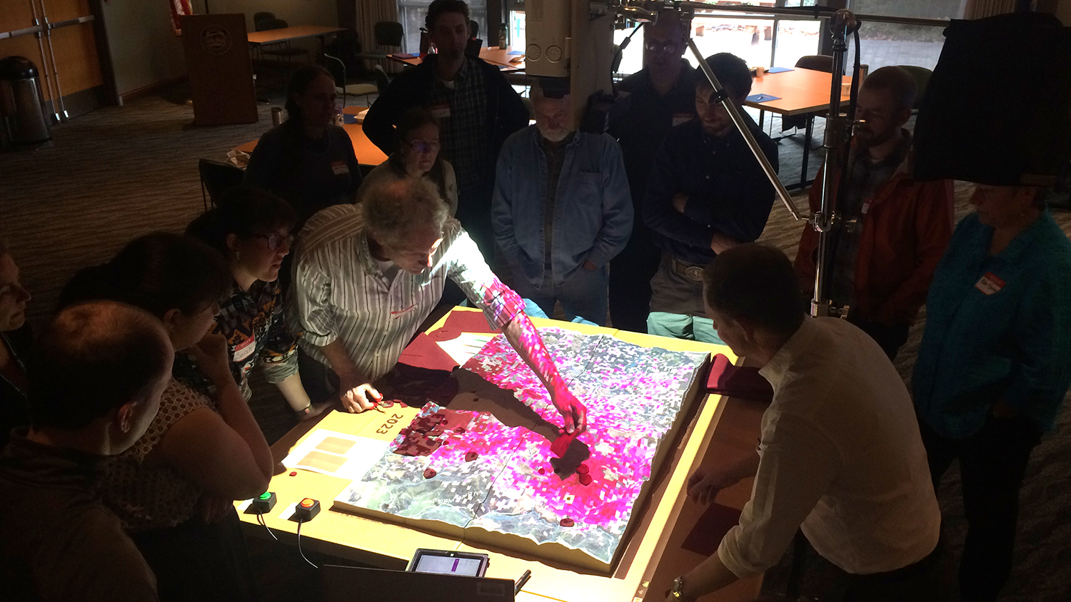 Stakeholders interact with a simulation of sudden oak death disease in Oregon