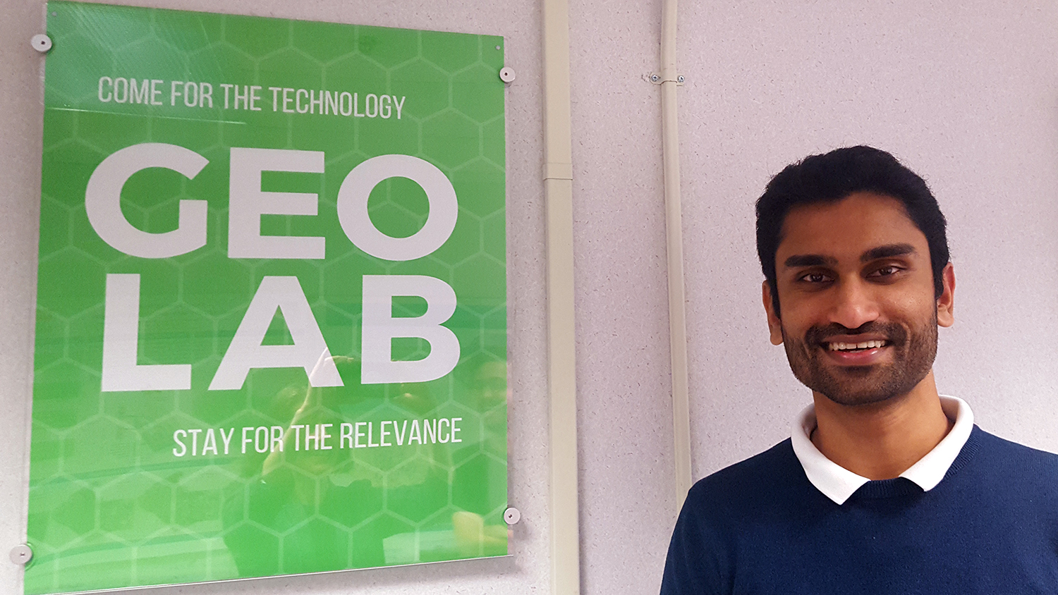 Vishnu Mahesh Vivek Nanda stands next to the GeoLab sign