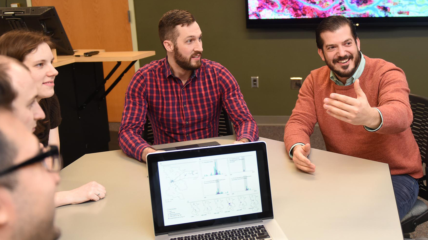 Jason Matney sits with fellow Center for Geospatial Analytics students