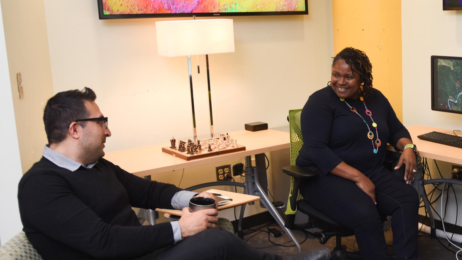 Mary Hicks chats with a student