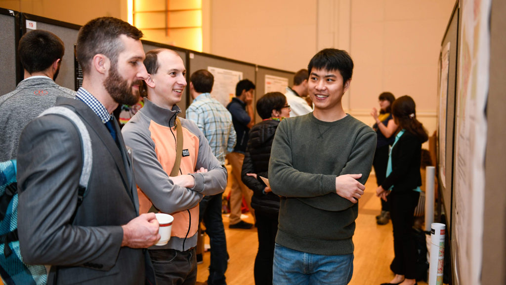Nick Kruskamp, Vaclav Petras, and Zekun Lin at a research sysmposium