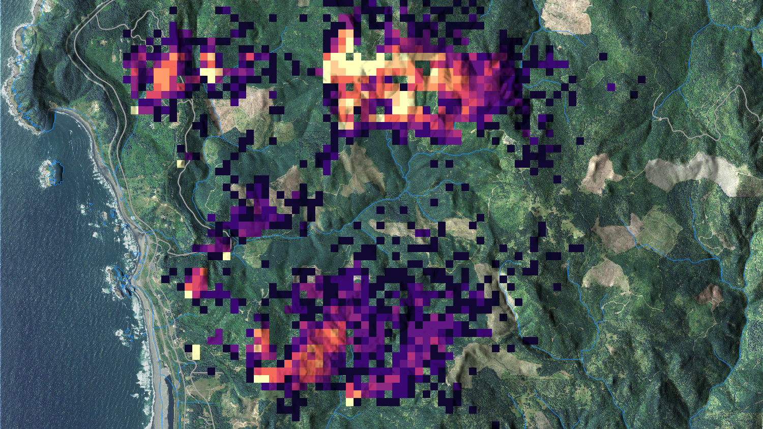 A photo of the silhouettes of two men in the Earth Observation and Remote Sensing Lab at the North Carolina State University Center for Geospatial Analytics