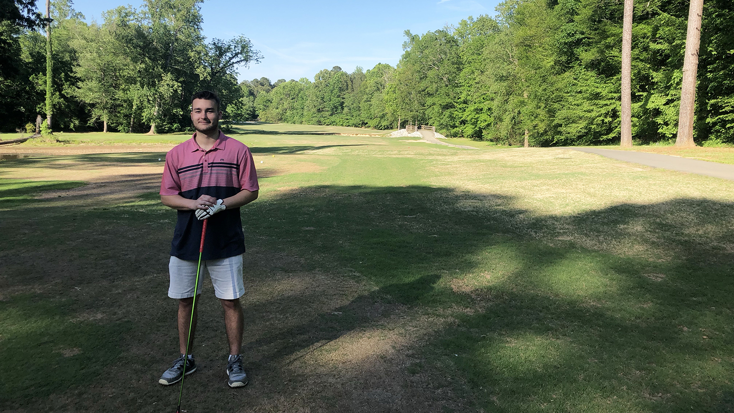 Student golfing