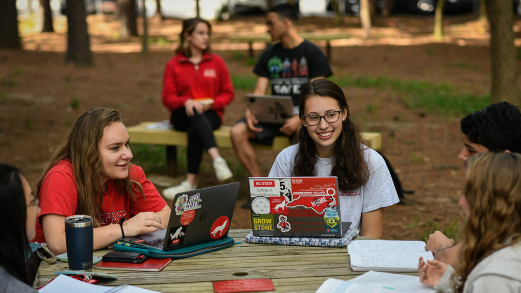 Group of students work on computers 