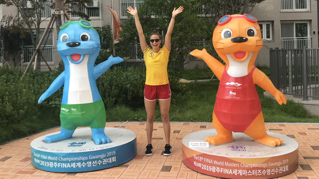 Student posing while swimming abroad