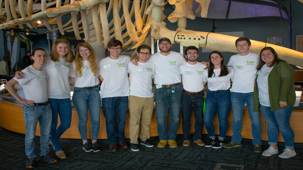 group poses at museum