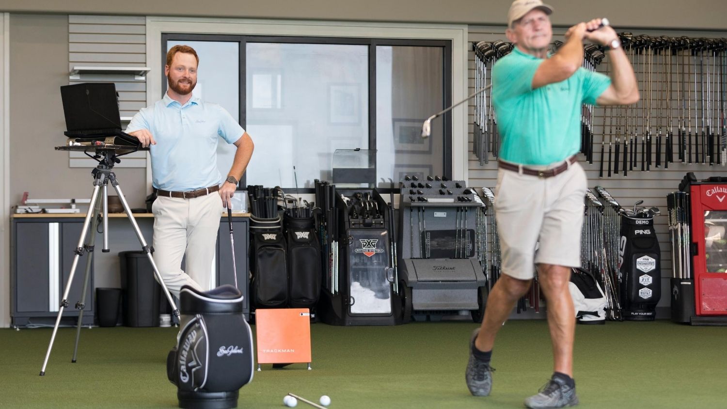 Tee Time: A Conversation with a Golf Club Fitter, College of Natural Resources, Ben Freundt fitting a club - feature