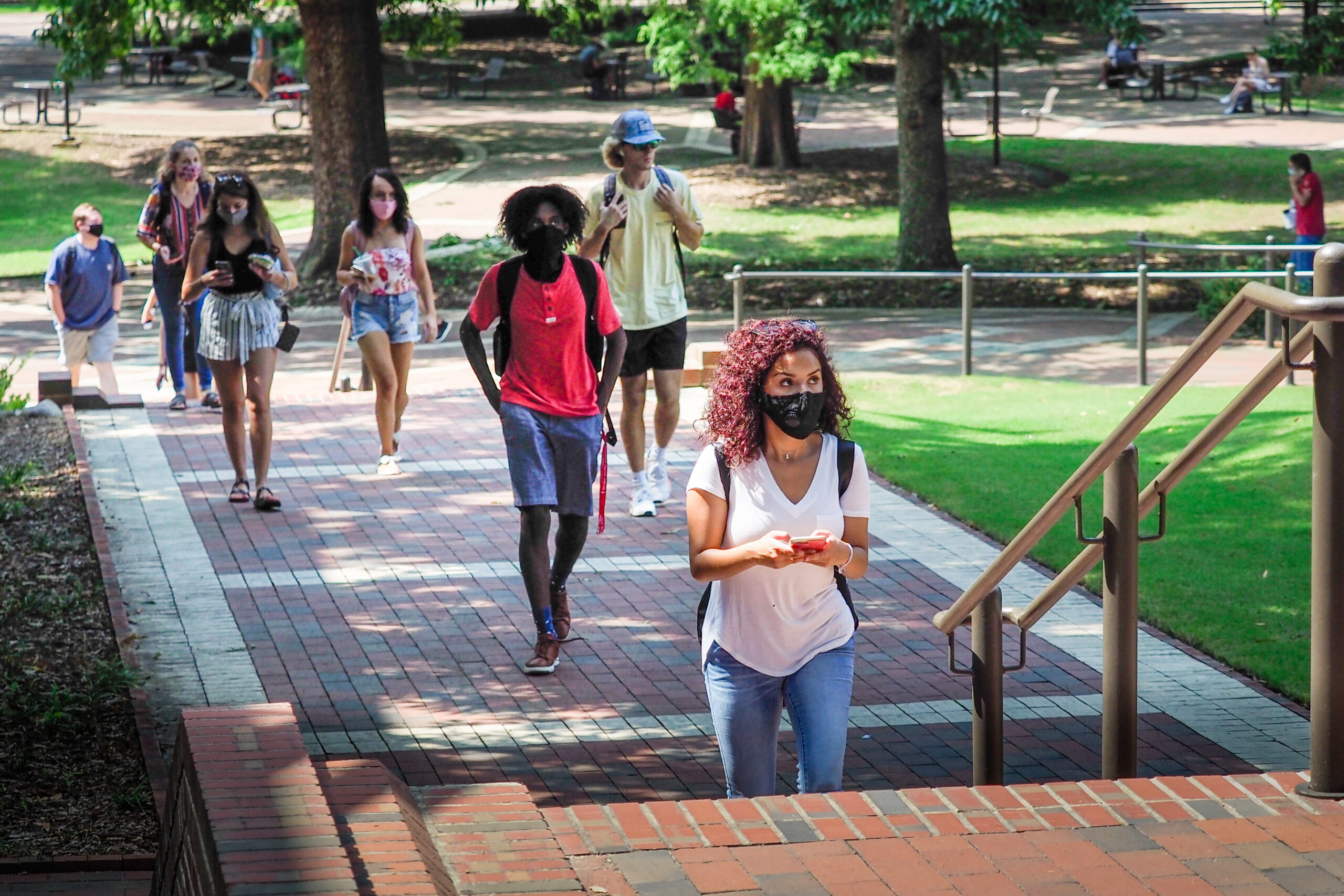 students on campus wearing masks