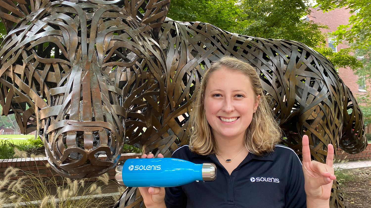 Claudia Patterson in Front of Wolf Statue - Graduation to Vocation: Finding Innovative Solution to Engineering Problems - - College of Natural Resources News NC State University