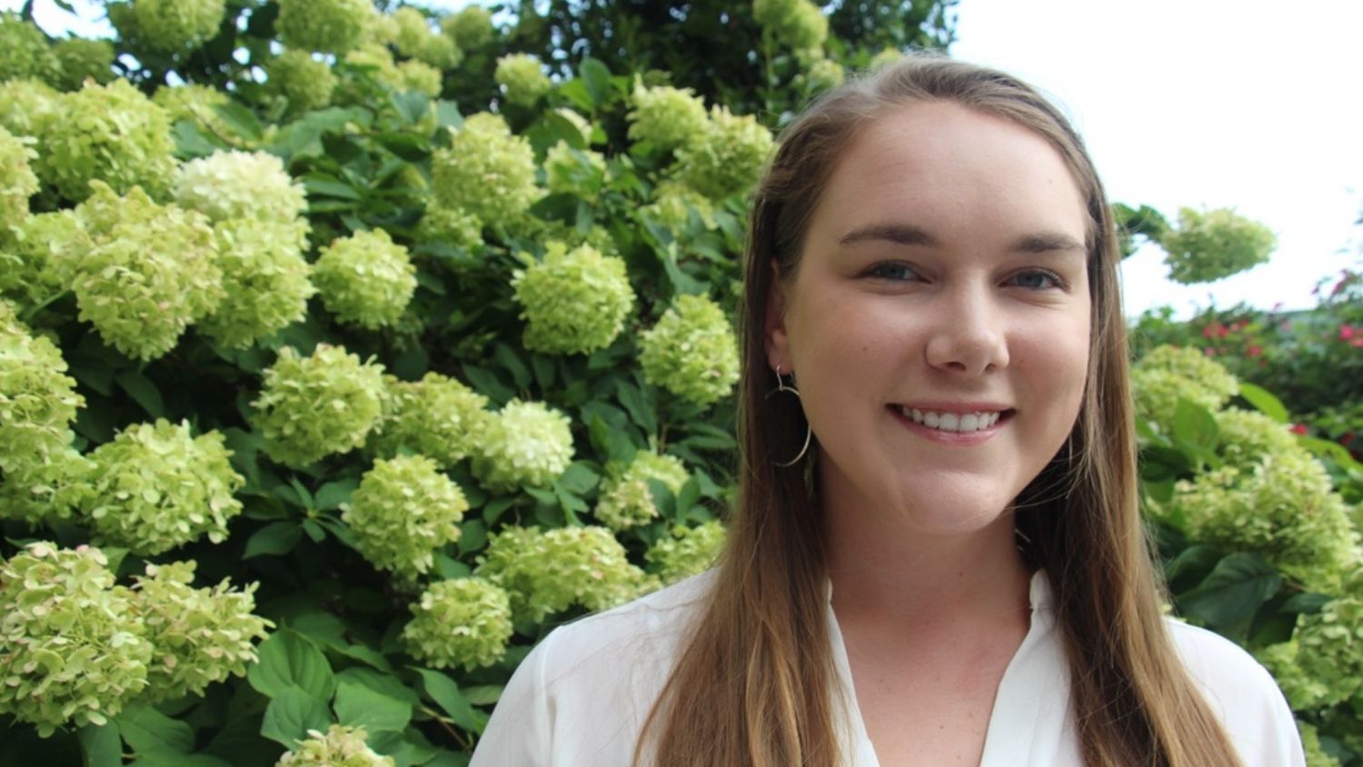 Kathryn Jewell Portrait in Front of Flowers -Global Change Fellow Kathryn Jewell Wants to Increase Collaboration in Wildlife Conservation - - College of Natural Resources News NC State University