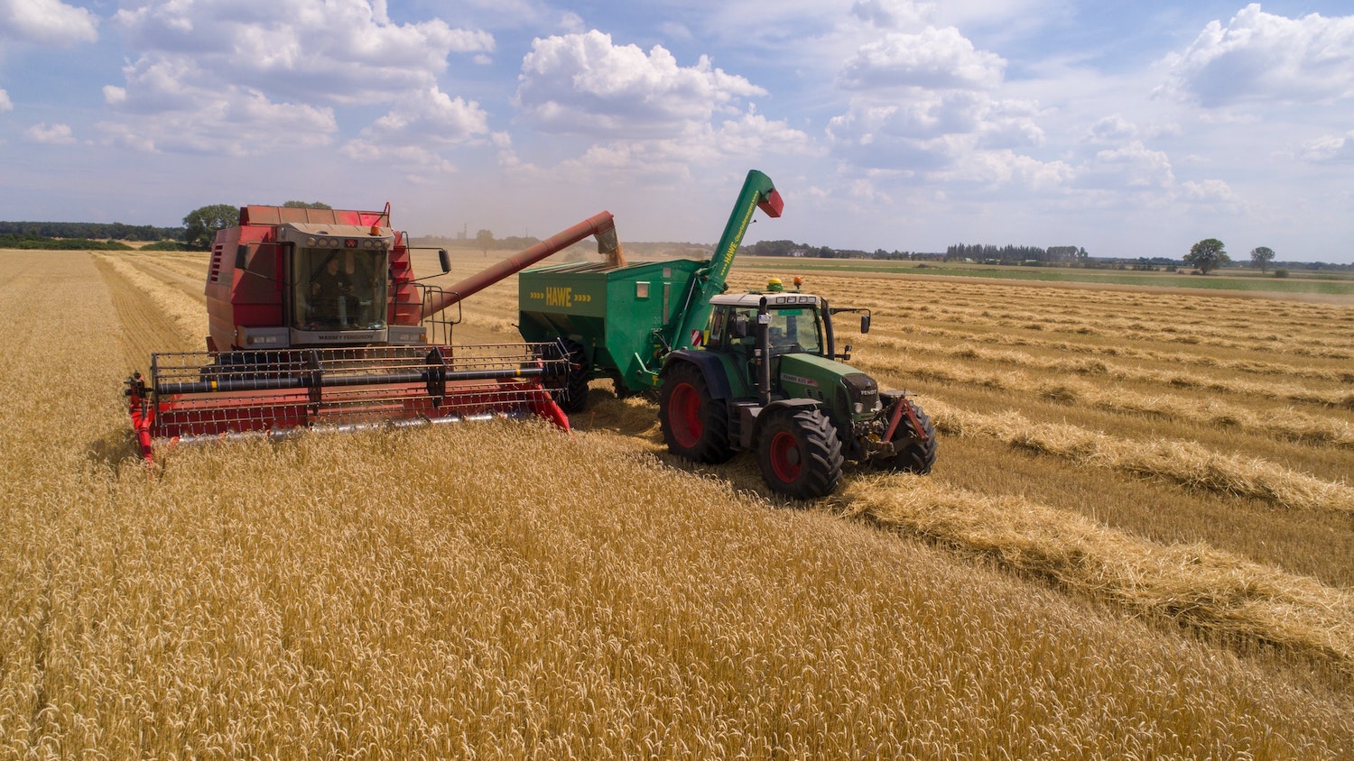 Tractor in a wheat field - How Animal Manure Could Help Reduce Agriculture's Carbon Footprint - - College of Natural Resources News NC State University