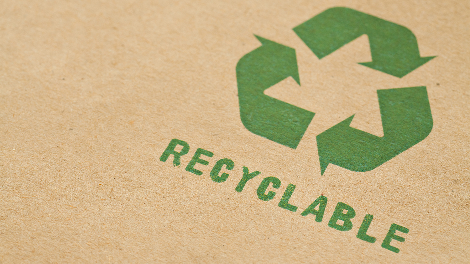 Green recycle symbol on cardboard - Tis the Season to Recycle - College of Natural Resources News NC State University