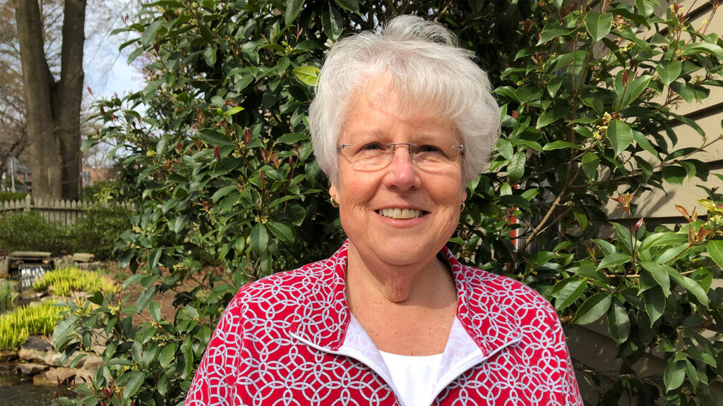 watzin poses in front of yellow flowers - Women in Natural Resources: Forestry Professor Mary Watzin - College of Natural Resources News NC State University