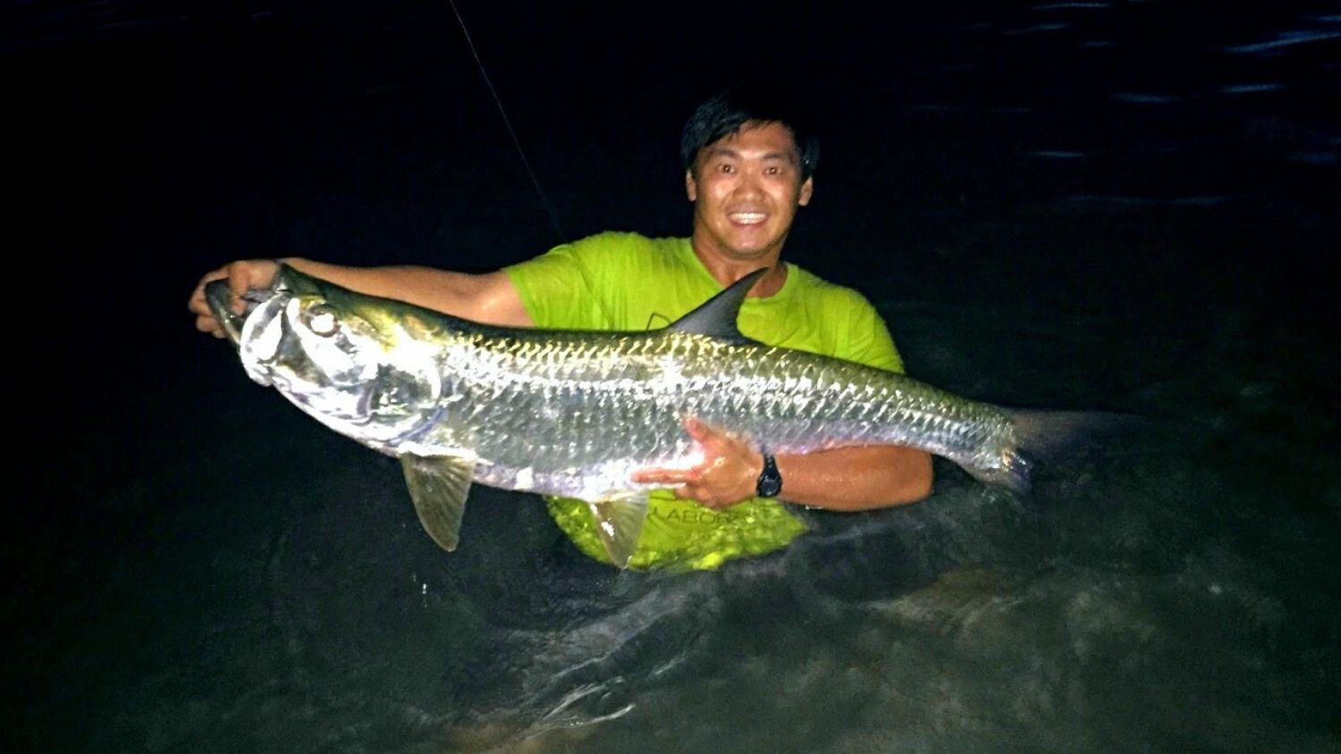 Doris Duke Scholar Wilson Xiong is a Conservation Researcher, Mentor, College of Natural Resources, Wilson Xiong with fish, feature