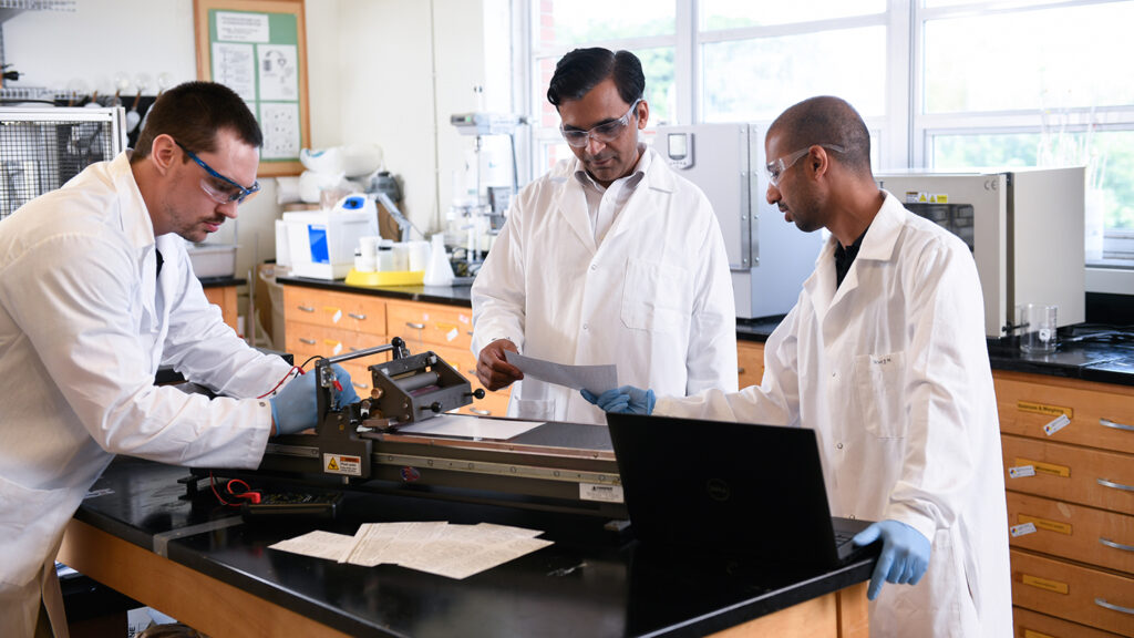 Lokendra Pal works in a laboratory with two colleagues - Lokendra Pal Named E.J. "Woody" Rice Associate Professor - College of Natural Resources - NC State University