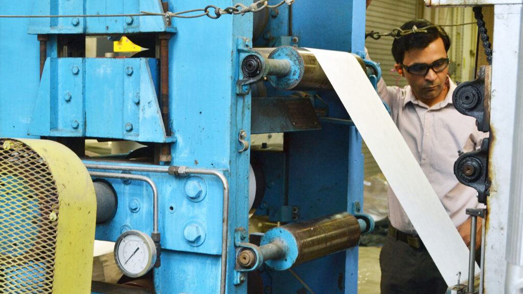 Lokendra Pal demonstrating a paper machine - Lokendra Pal Named E.J. "Woody" Rice Associate Professor - College of Natural Resources - NC State University