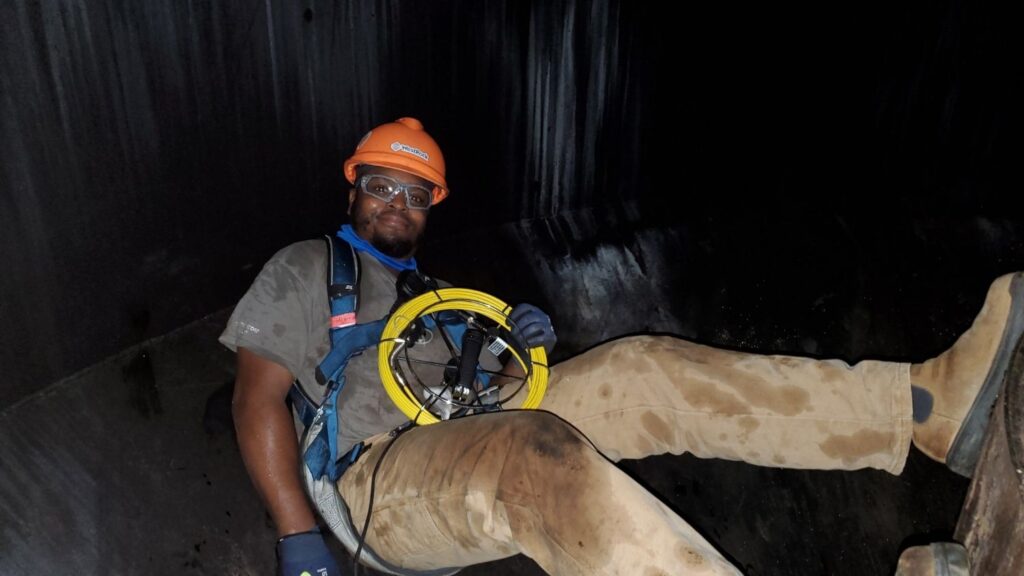 Elijah Gore doing maintenance work for West Rock