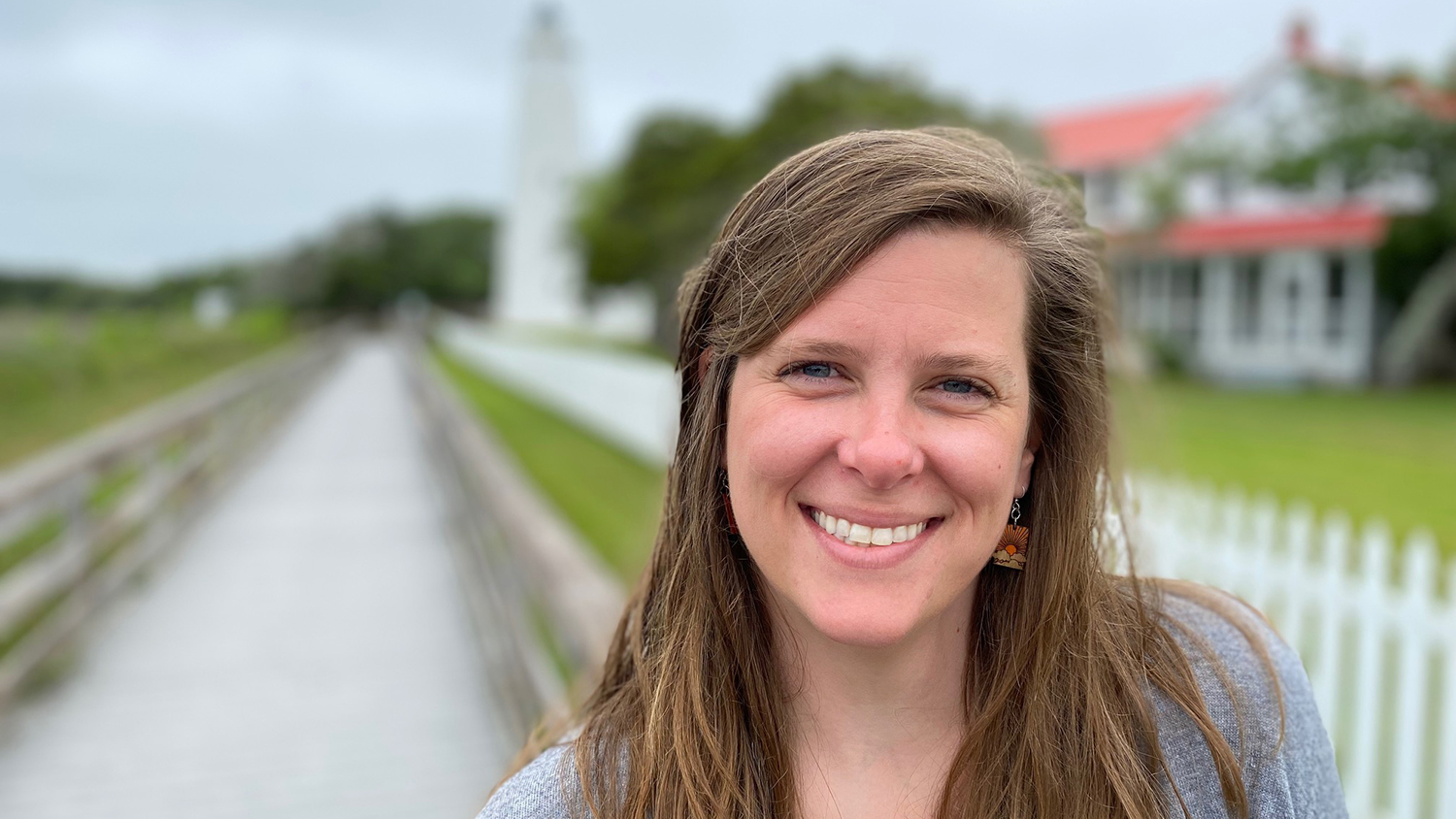 Ann stands in front of Ocracoke Lighthouse - Meet Tourism Extension Associate Ann Savage - College of Natural Resources News NC State University