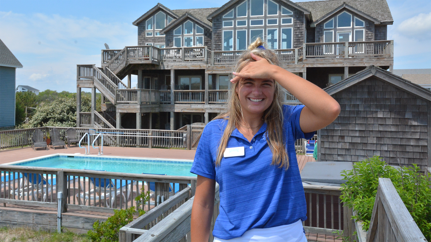 NC State student Micaela Nardino poses for a photo in front of the Twiddy and Company headquarters in Corolla, North Carolina - Twiddy & Company Intern Micaela Nardino Promotes Outer Banks Tourism - College of Natural Resources News NC State University