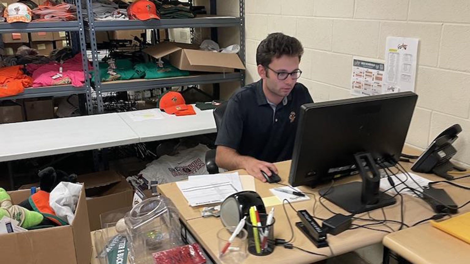 NC State student Mason Cook inputs data on a computer - Greensboro Grasshoppers Intern Mason Cook Develops Sport Management Skills - College of Natural Resources News NC State University