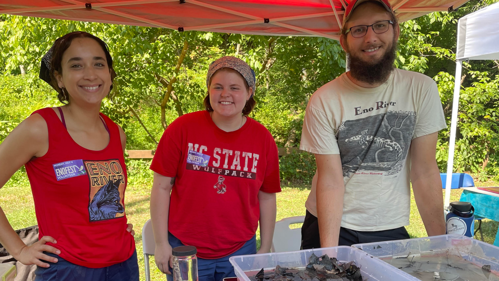 From left to right: Taliana Tudryn, a senior majoring in fisheries, wildlife and conservation biology, and classmates presenting their research on the Neuse River Waterdog.