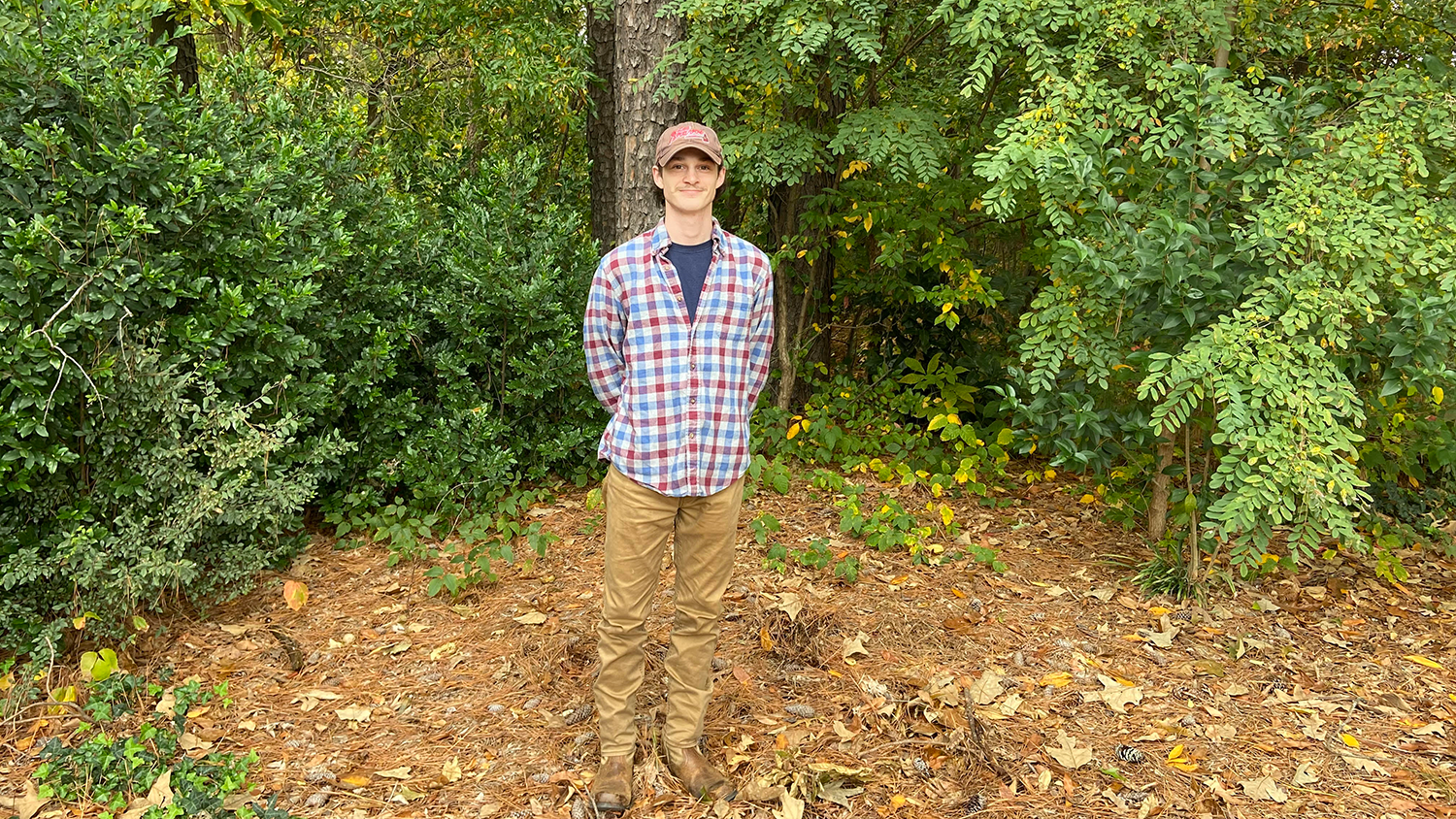 Jared Spurlin standing in a forested area - - 5 Questions with Campus As A Classroom Intern Jared Spurlin - College of Natural Resources News NC State University