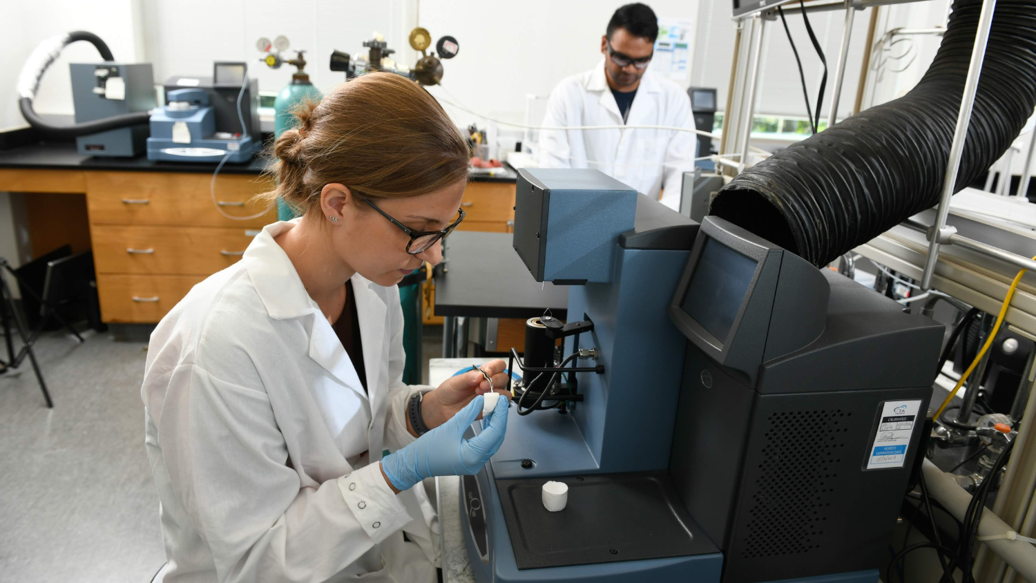 Nathalie Lavoine examines a bioproduct in a lab - Nathalie Lavoine Selected for 2022 TAPPI NanoDivision Mid-Career Award - College of Natural Resources News NC State University