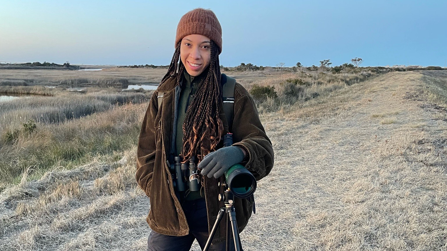 Kayla Stukes standing in a field - Meet National Needs Fellow Kayla Stukes - College of Natural Resources News NC State University