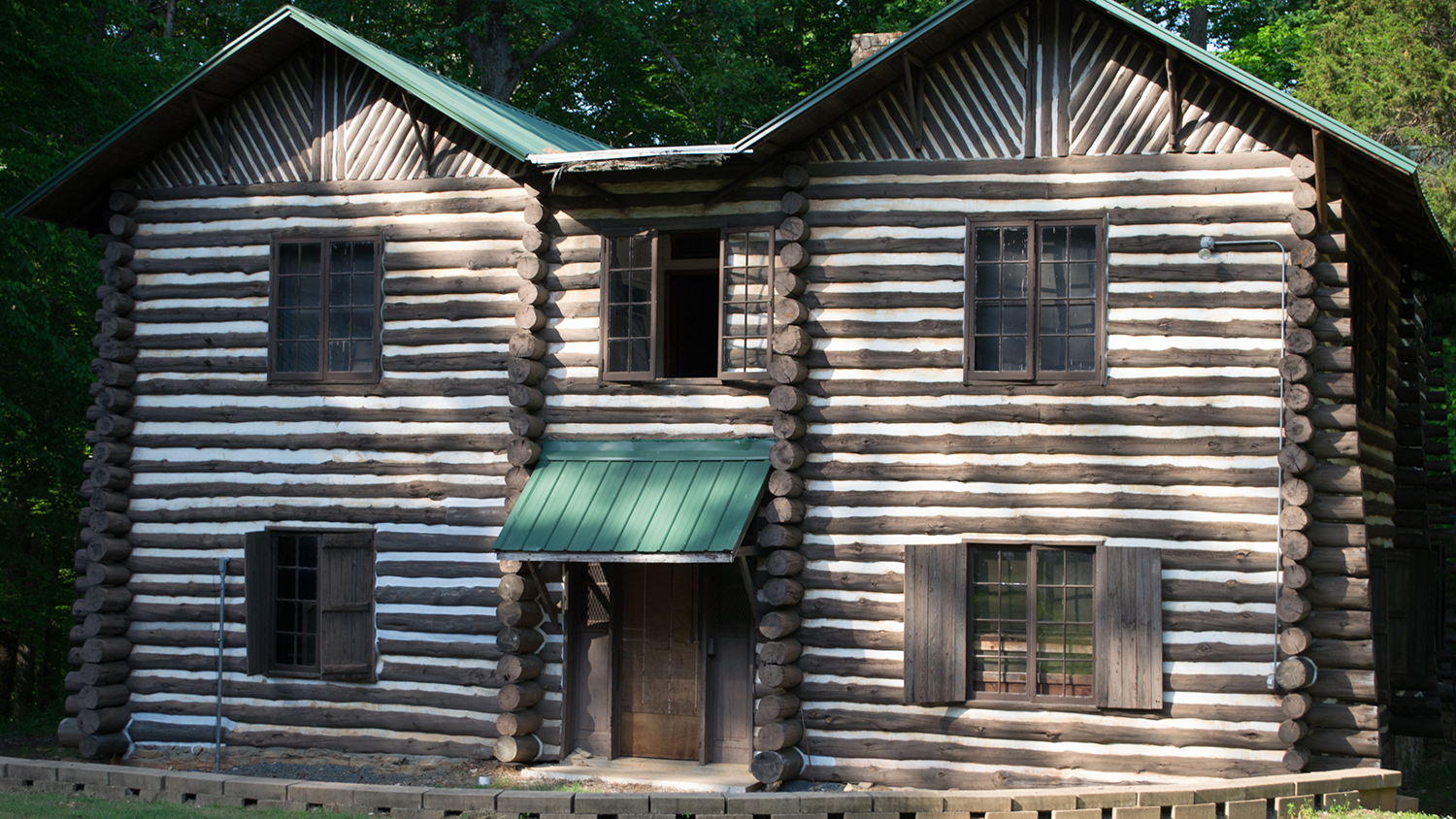 Wide-angle photo showing the exterior of the historic lodge at Slocum Camp in Rougemont, North Carolina - New Campaign Hopes to Bring New Life to Forestry Summer Camp - College of Natural Resources News NC State University