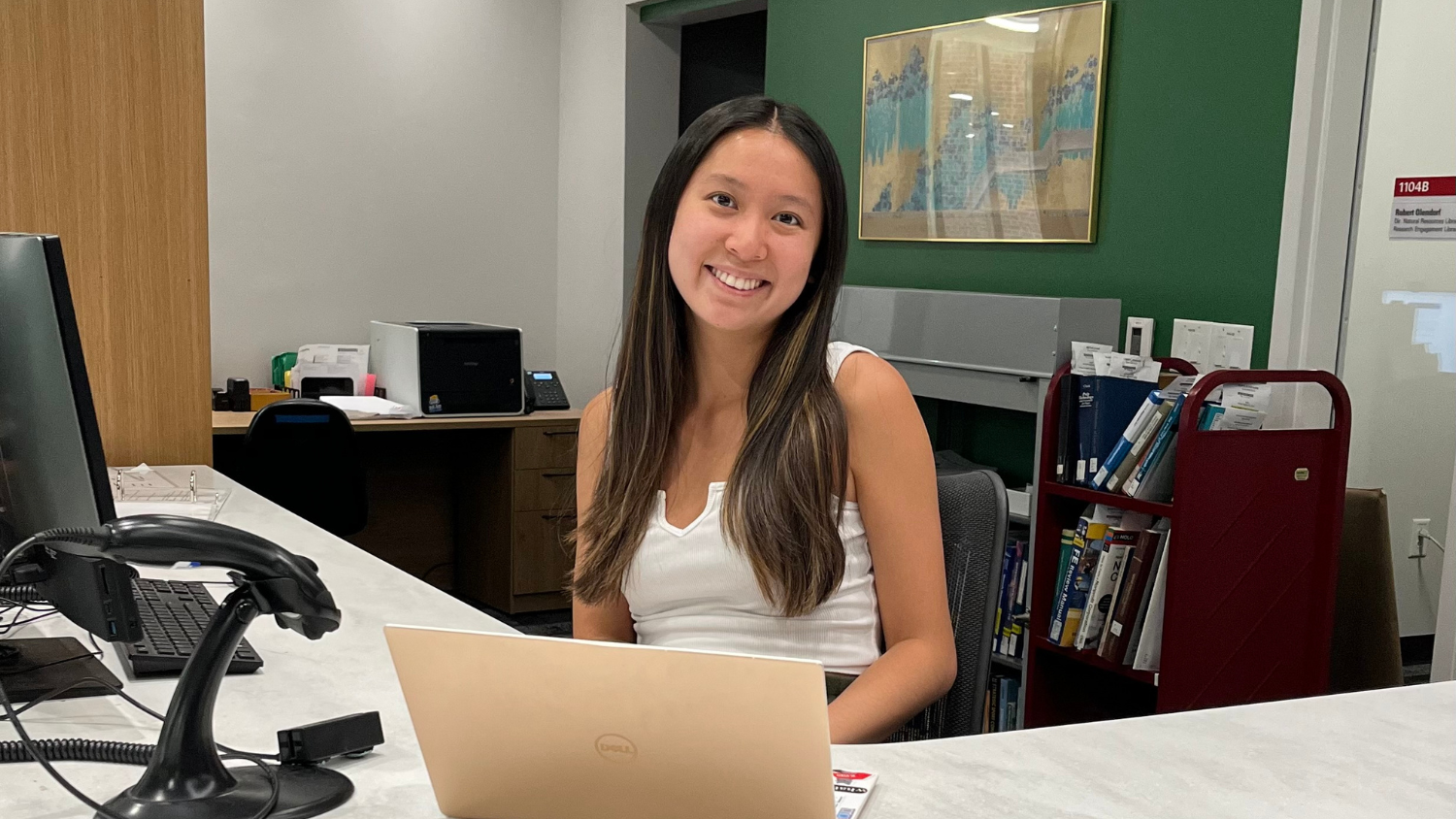 Brianna sits at library desk - Libraries Scholarship Fund Supports Brianna Bud's Passion for Engineering - College of Natural Resources News NC State University