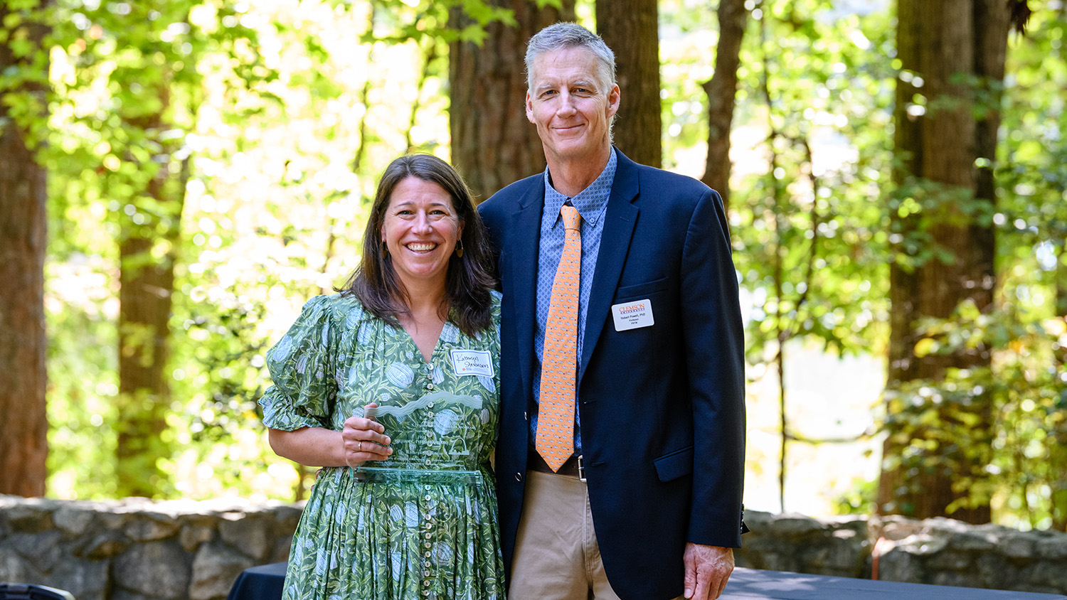 Kathryn Stevenson standing beside Robert Powell in a forested area - NC State Professor Recognized for Advancing Environmental Education - College of Natural Resources News NC State University