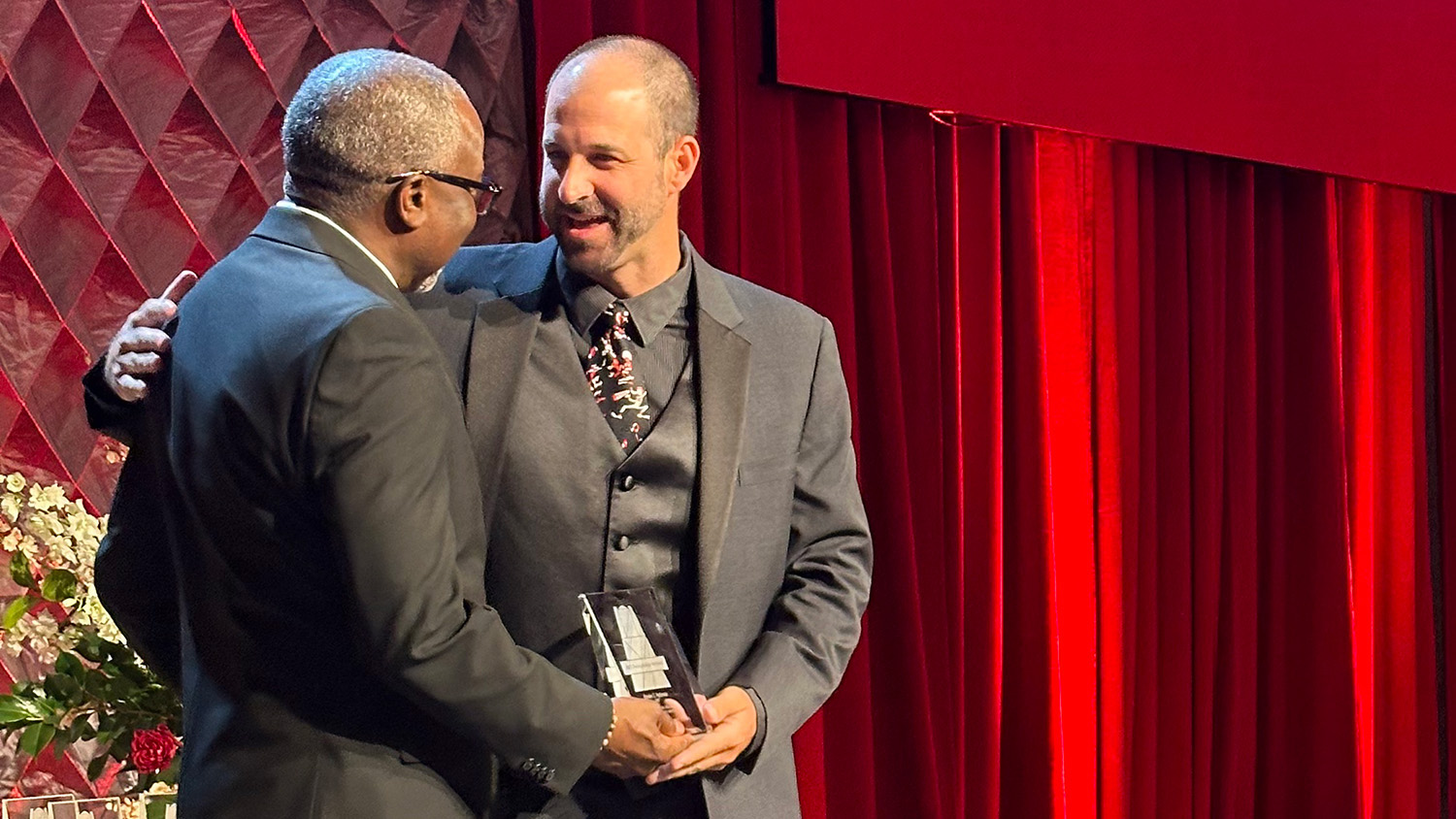 Dean Myron Floyd presents award to Braden Holloway - Braden Holloway Named 2023 Distinguished Alumnus of the Year - College of Natural Resources News NC State University