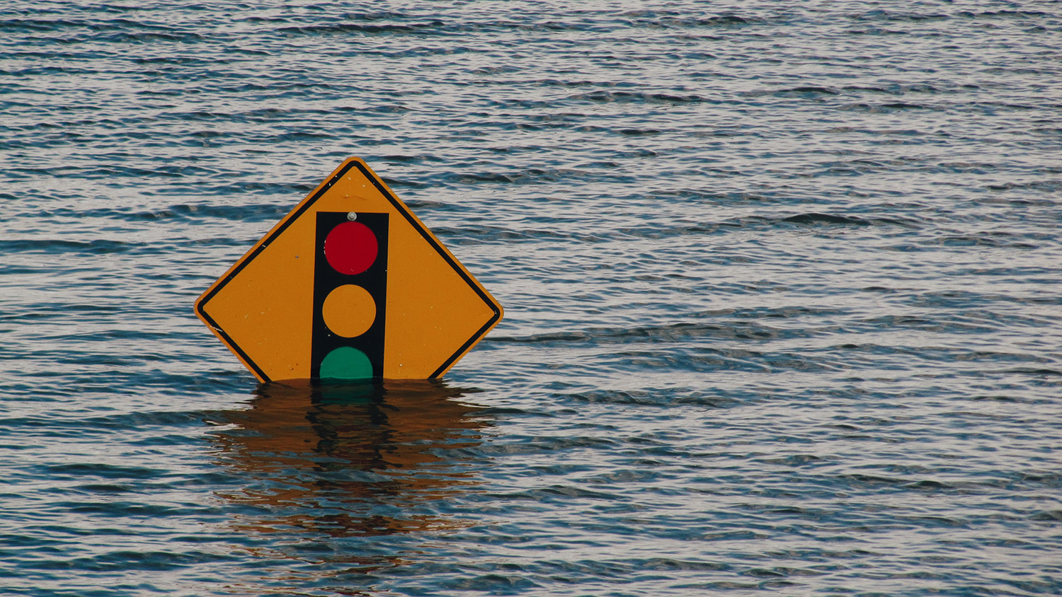Traffic light sign underwater.